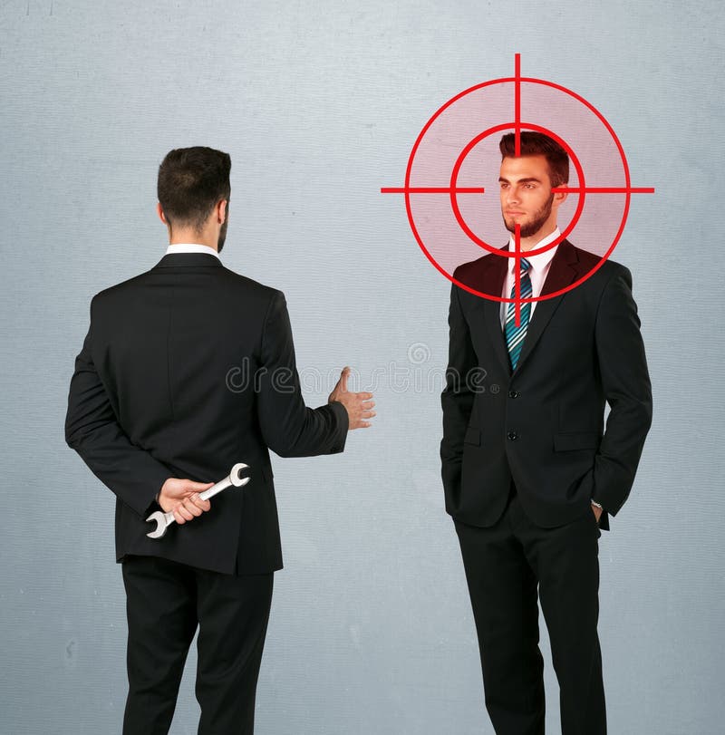 Ruthless businessman handshake with a hiding weapon and a head target point. Ruthless businessman handshake with a hiding weapon and a head target point