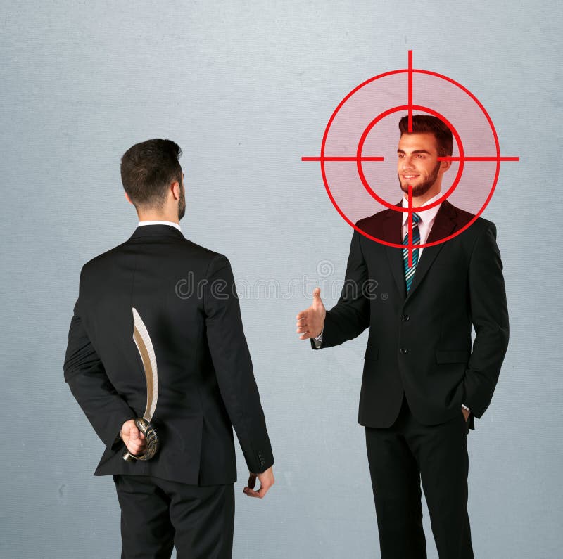 Ruthless businessman handshake with a hiding weapon and a head target point. Ruthless businessman handshake with a hiding weapon and a head target point