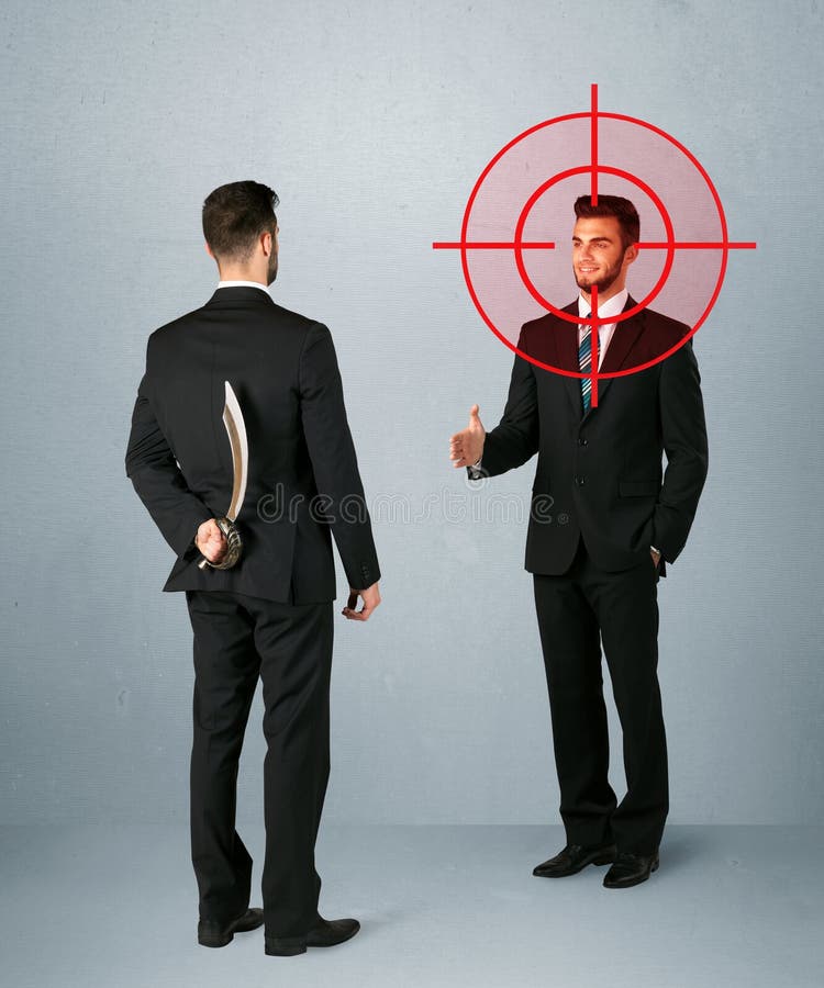 Ruthless businessman handshake with a hiding weapon and a head target point. Ruthless businessman handshake with a hiding weapon and a head target point