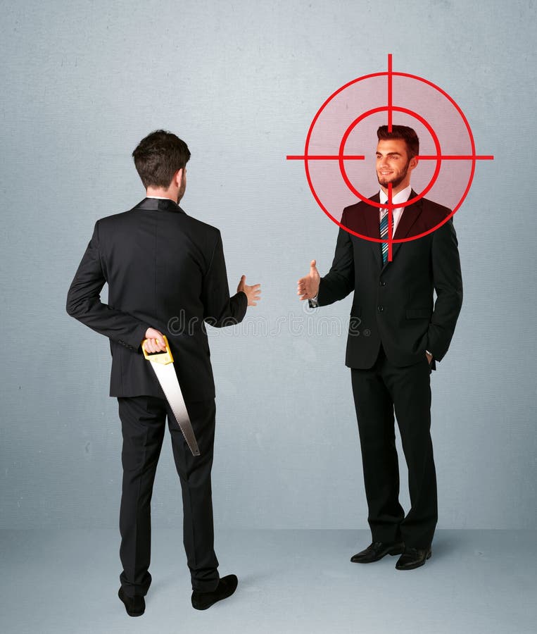 Ruthless businessman handshake with a hiding weapon and a head target point. Ruthless businessman handshake with a hiding weapon and a head target point