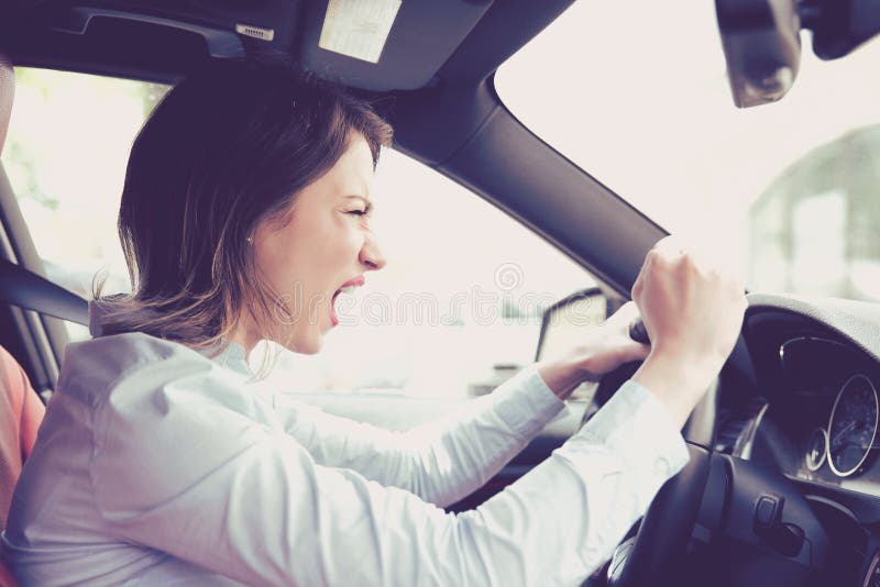 Side profile angry female driver. Negative human emotions face expression. Side profile angry female driver. Negative human emotions face expression