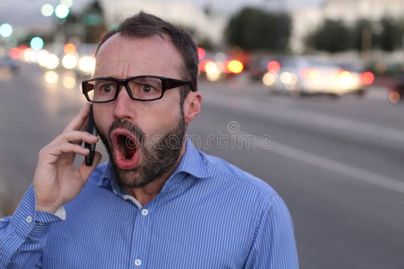 Angry furious businessman on cell phone call yelling and screaming in city. Angry furious businessman on cell phone call yelling and screaming in city.