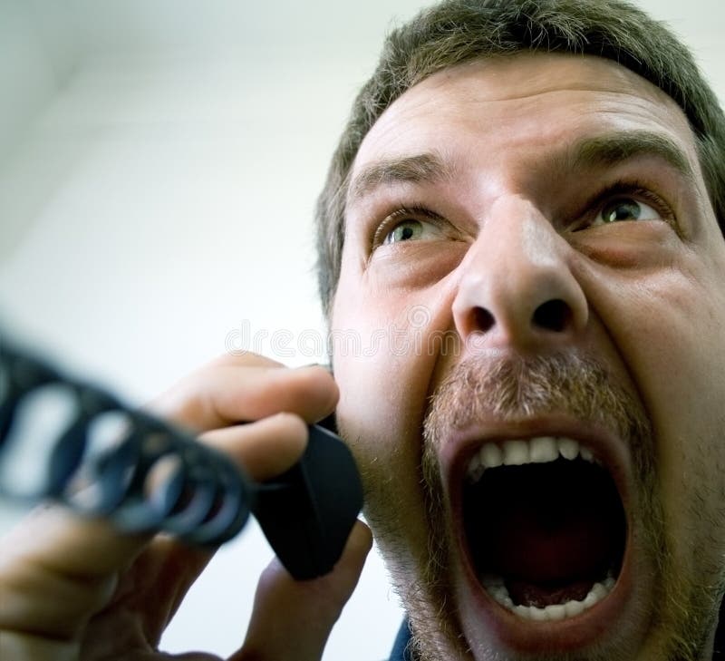 Portrait of angry stressed businessman screaming at the phone. Portrait of angry stressed businessman screaming at the phone