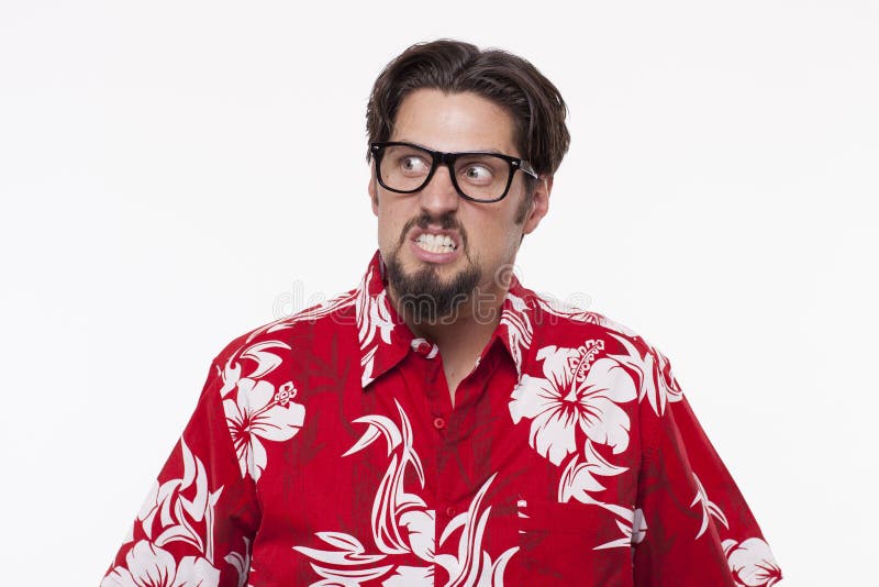 Image of a angry young man in Hawaiian shirt posing against whit