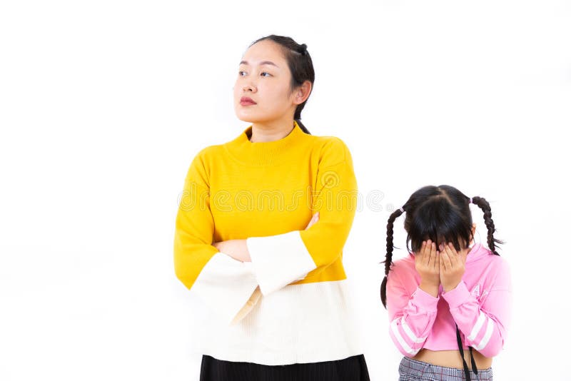 The image of an Asian mother and daughter being angry in a white background stock photo