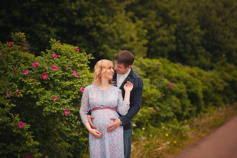 Image Of Beautiful Pregnant Woman And Her Handsome Husband Hugging The Tummy Stock Image Image 