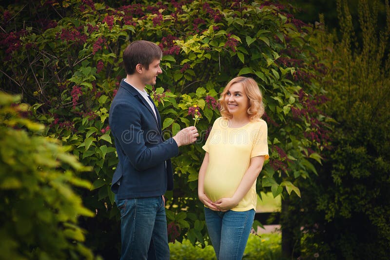 Image Of Beautiful Pregnant Woman And Her Handsome Husband Hugging The Tummy Stock Image Image