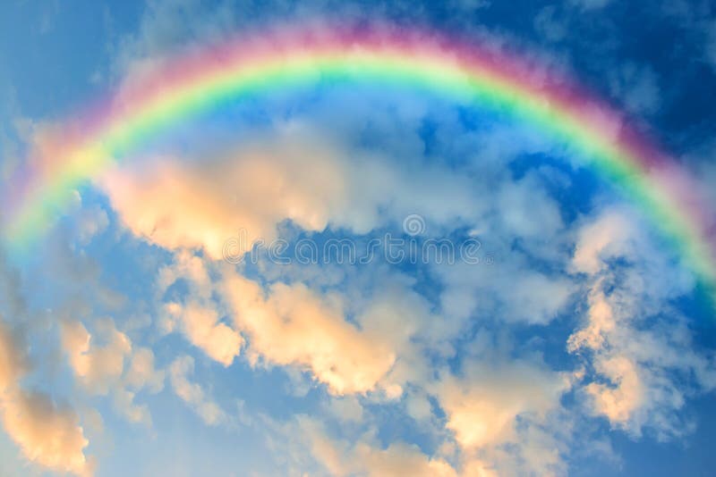 Image of beautiful sky at dusk with colorful clouds and a rainbow for abstract background. Image of beautiful sky at dusk with colorful clouds and a rainbow for abstract background.