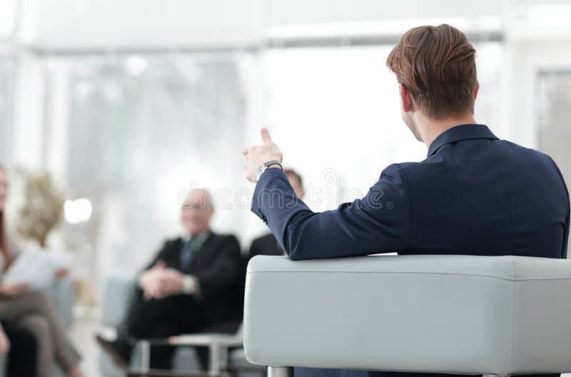 Image is blurred.businessman conducting a meeting royalty free stock photo Image is blurred.businessman conducting a meeting royalty free stock photo
