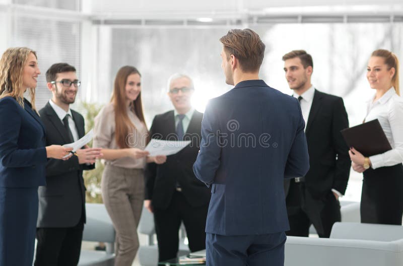 Image is blurred.the Manager makes a report to the business team.