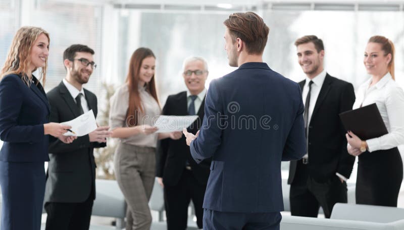 Image is blurred.the Manager makes a report to the business team.