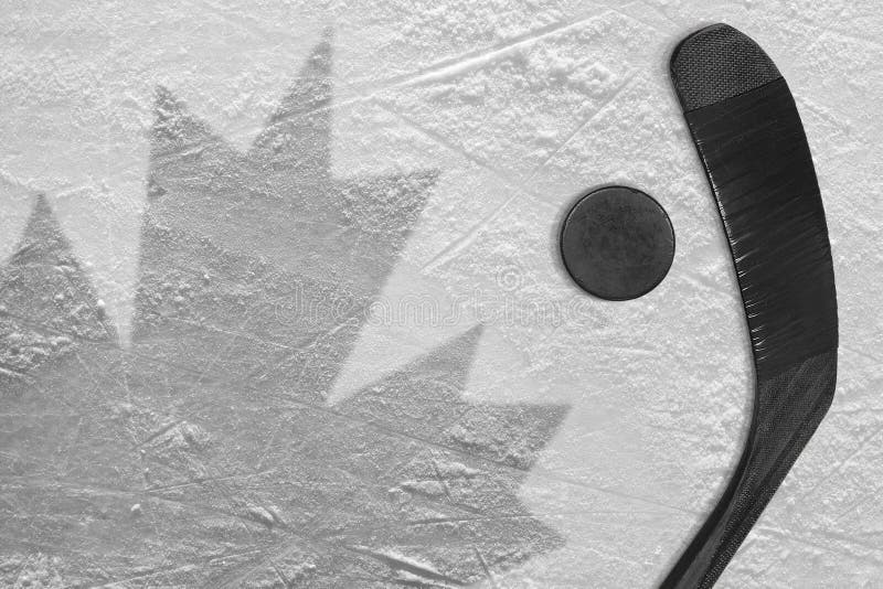 The Image of the Canadian Flag and Hockey Puck with the Stick Stock