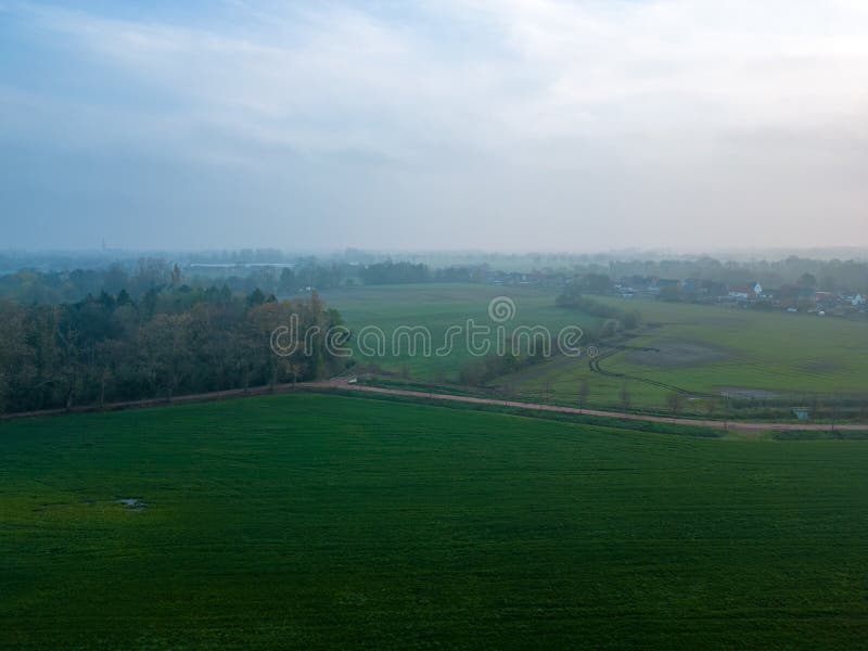 Misty Dawn Over Gentle Rolling Farmland stock image