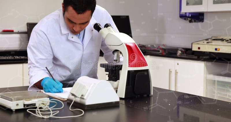 Image of chemical formulas over biracial male lab worker using microscope stock image