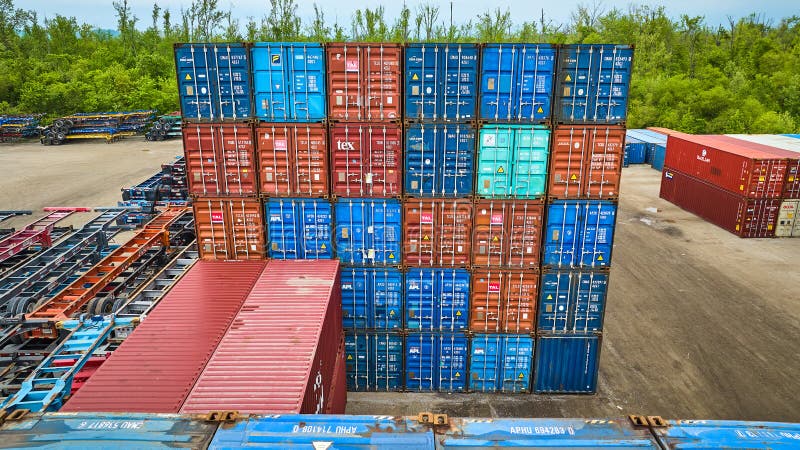 Image of Colorful square formation of ends of shipping crates metal containers stacked aerial