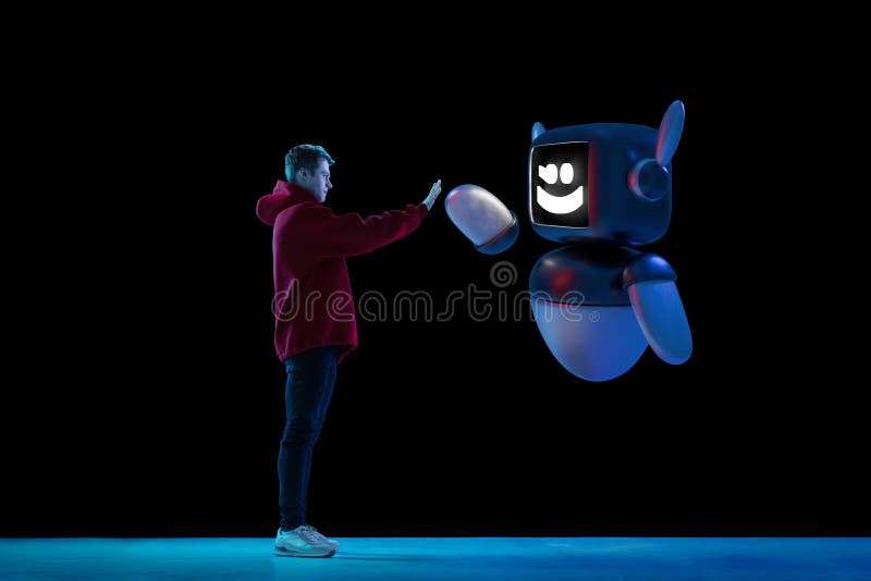Image composite du jeune homme interagissant avec le modèle 3D du robot symbolisant la connexion humanrobot à travers interactif photo stock