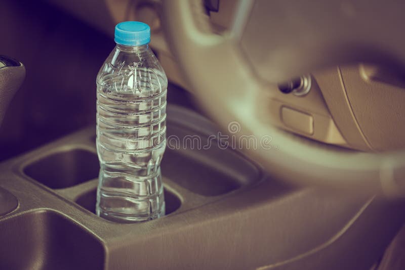 Image concept Bottled water was left in the car for a long time. To drink it .