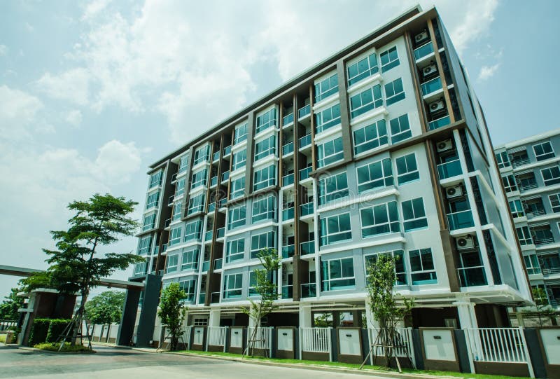 Image of Condo on Afternoon with Blue Sky Background. Stock Image