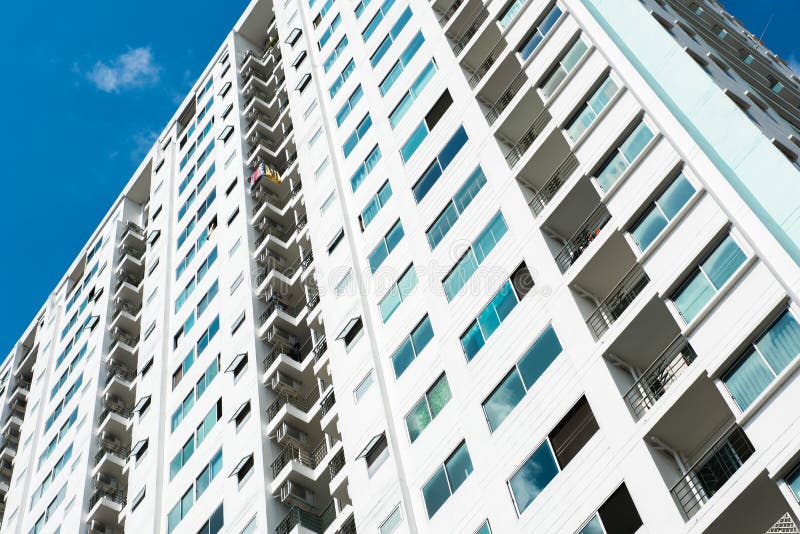 Image of Condo Building and Blue Sky Background. Stock Photo Image of