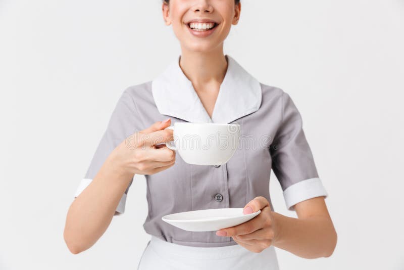 Image cultivée d'une jeune bonne de sourire photographie stock Image cultivée d'une jeune bonne de sourire photographie stock