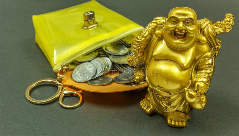 IMAGE DEPICTING THE FINANCIAL SITUATION SEEN WITH COINS INSIDE A PURSE WITH LAUGHING BUDDHA. WITH SELECTIVE FOCUS ON THE SUBJECT.