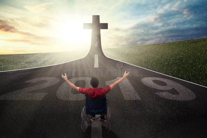 Disabled man with number 2019 and cross royalty free stock images Disabled man with number 2019 and cross royalty free stock images