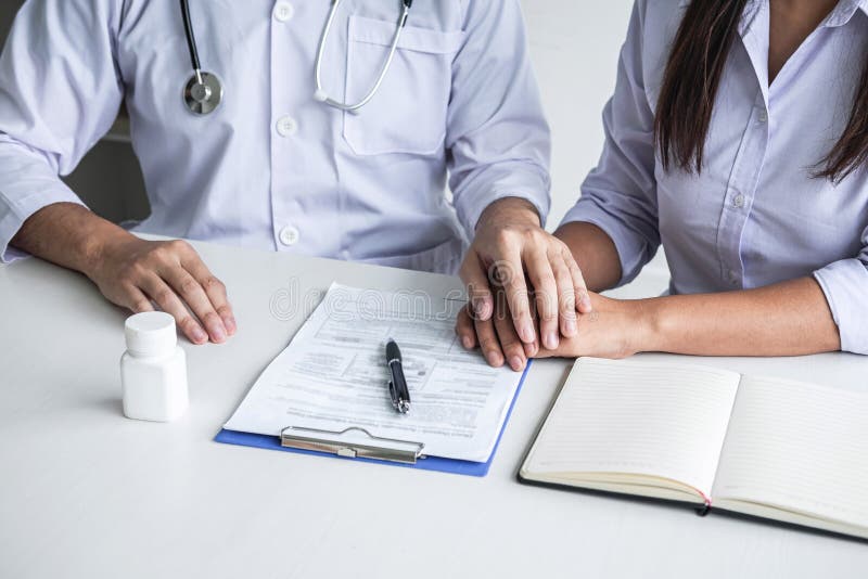 Image of doctor holding patient hand to encourage, talking with patient cheering and support, healthcare and medical assistant stock photo Image of doctor holding patient hand to encourage, talking with patient cheering and support, healthcare and medical assistant stock photo
