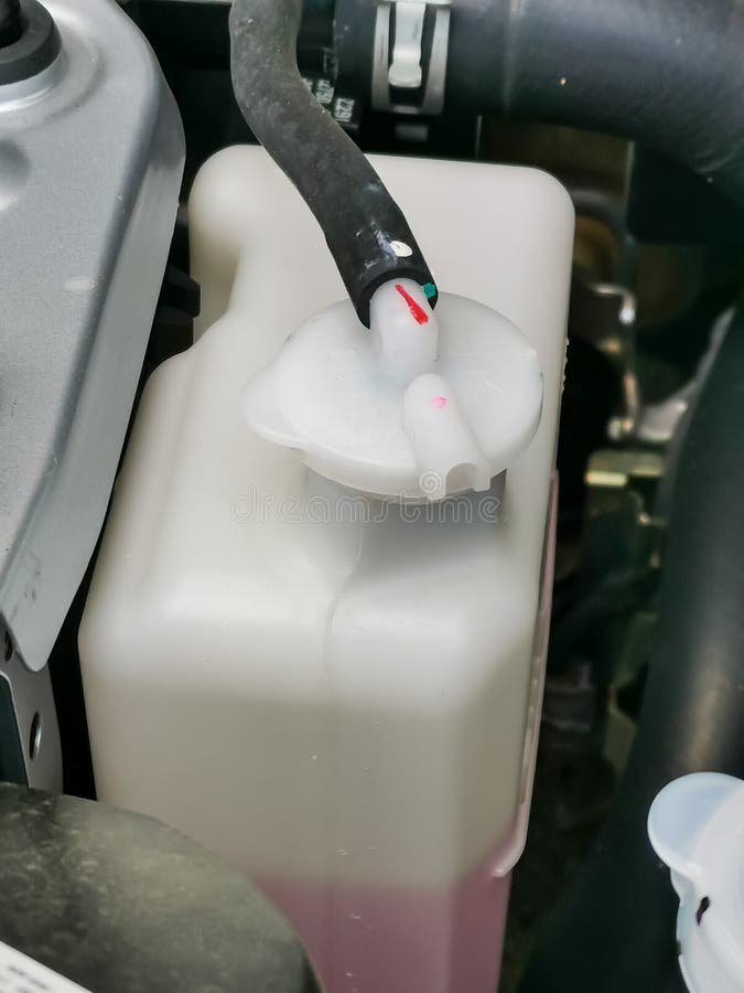 Image of Dusty Car Water Tank Coolant in Engine Compartment. Selective