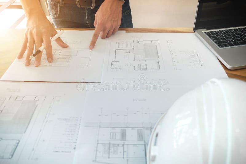 Image of engineer or architectural project, Close up of architects engineering working on blueprint with engineering equipment to royalty free stock image Image of engineer or architectural project, Close up of architects engineering working on blueprint with engineering equipment to royalty free stock image
