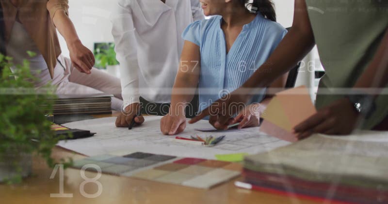 Image of financial data processing over diverse business people in office royalty free stock images