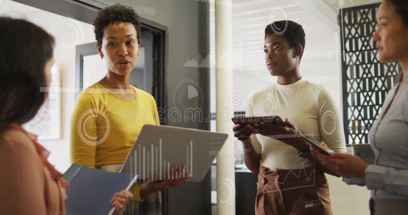 Image of financial data processing over diverse business people in office stock image