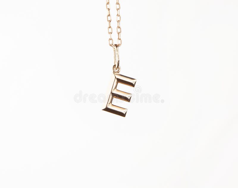Image of gold pendant white background royalty free stock images