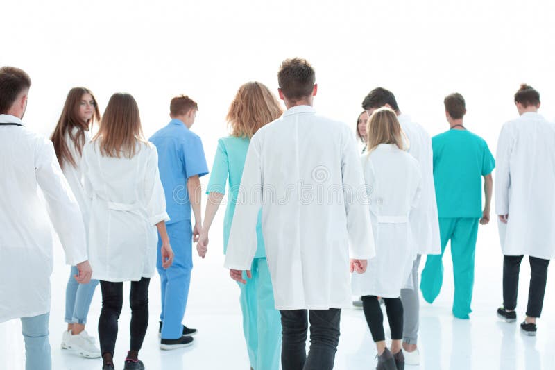 Image of a group of doctors walking in a hospital corridor. stock images