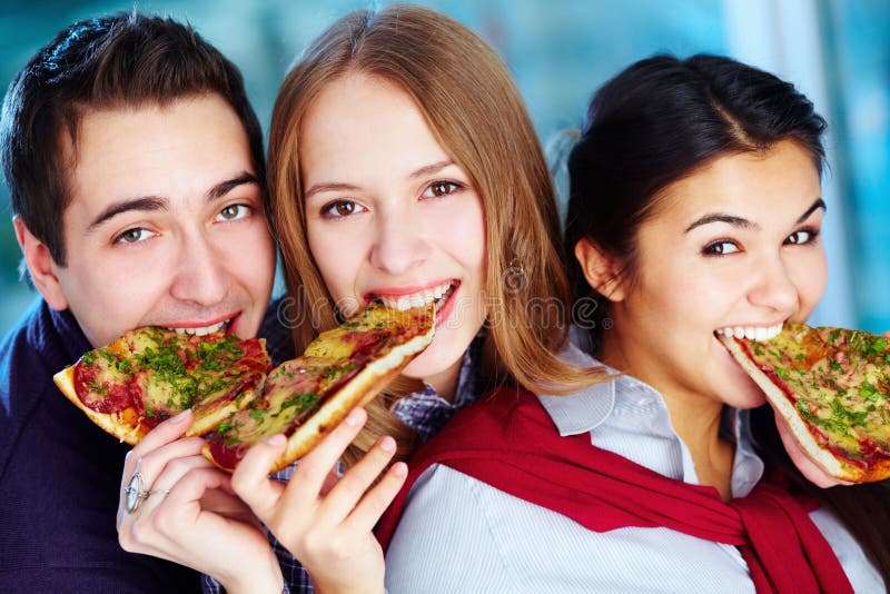 Three Friends Eating Pizza Stock Photo, Picture and Royalty Free Image.  Image 10735477.