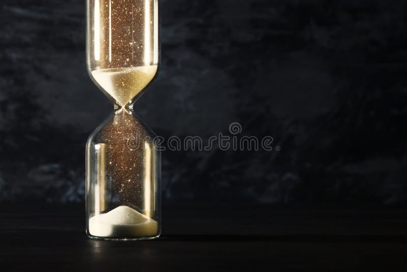 Image of hourglass as time passing concept over black background for business deadline. Glitter overlay.