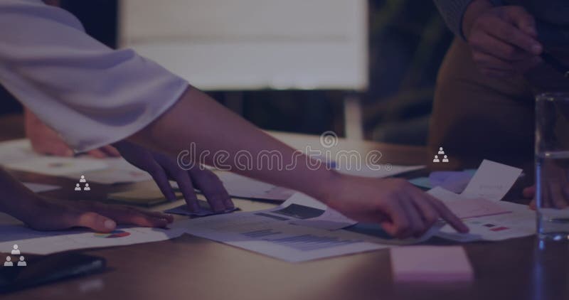 Image of icons over diverse business people working at office stock photos