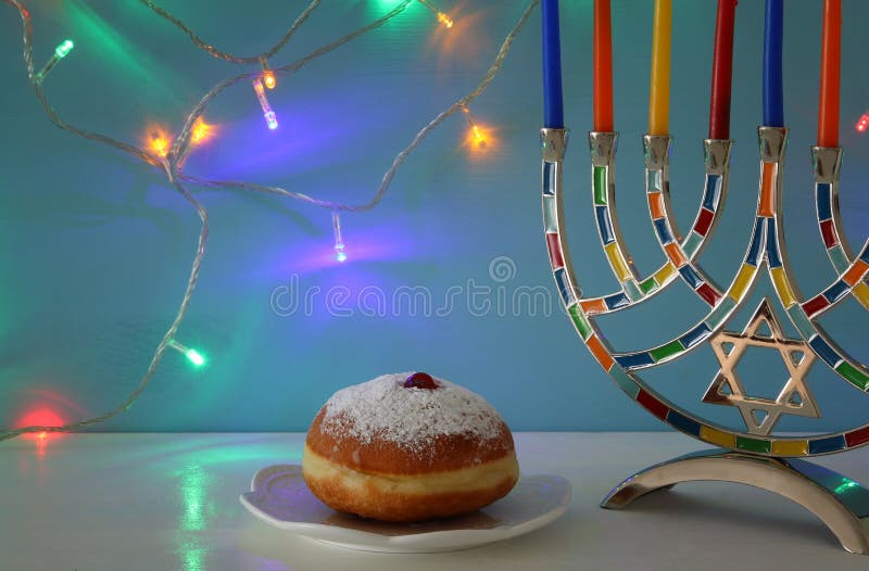 image of jewish holiday Hanukkah background with menorah & x28;traditional candelabra& x29; and candles.