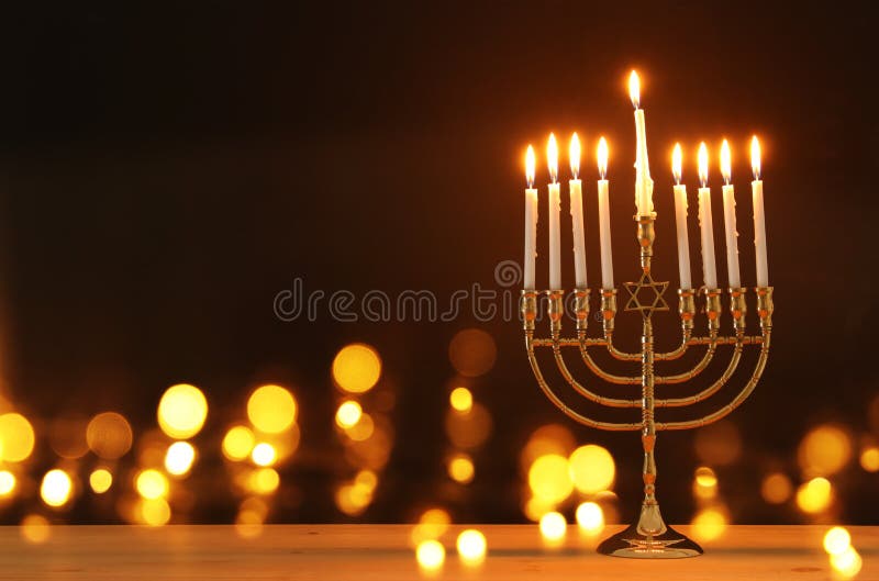 image of jewish holiday Hanukkah background with menorah & x28;traditional candelabra& x29; and candles.