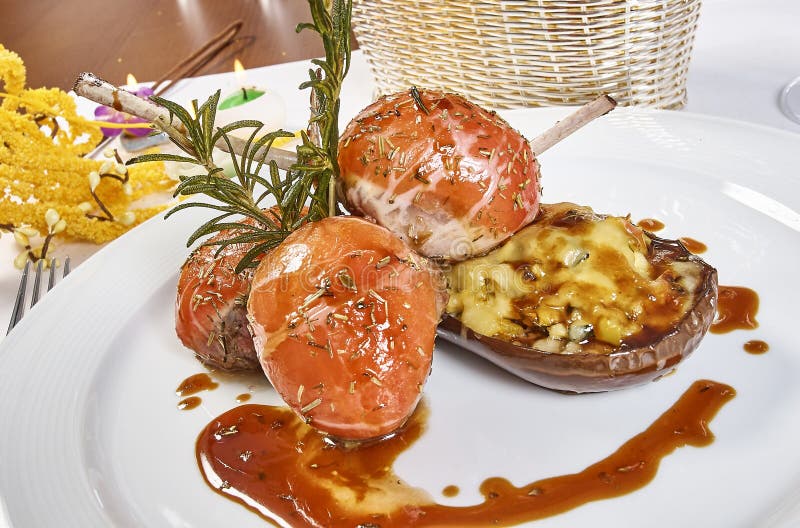 Image of Lamb Chops on a Bed of Vegetables Eggplant Stuffed with Vegetables Stock Photo Image