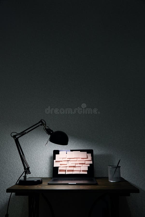 Image of laptop full of sticky notes reminders on screen. Late night work overload concept image. Working at night concept image royalty free stock image