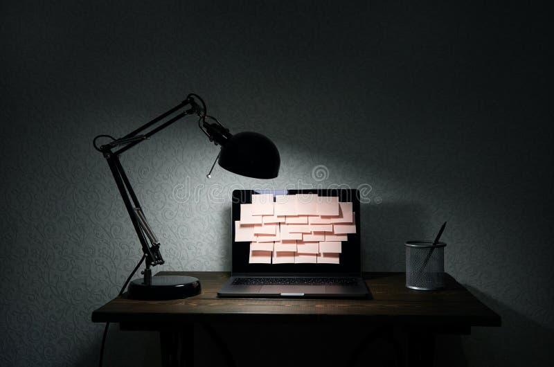 Image of laptop full of sticky notes reminders on screen. Late night work overload concept image. Working at home concept image stock photo