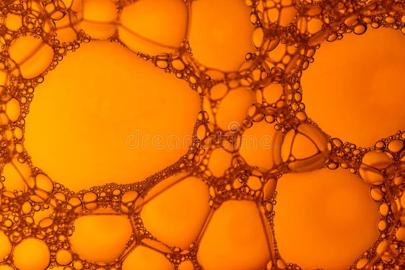 The image is of a large, orange blob with many small bubbles royalty free stock photos
