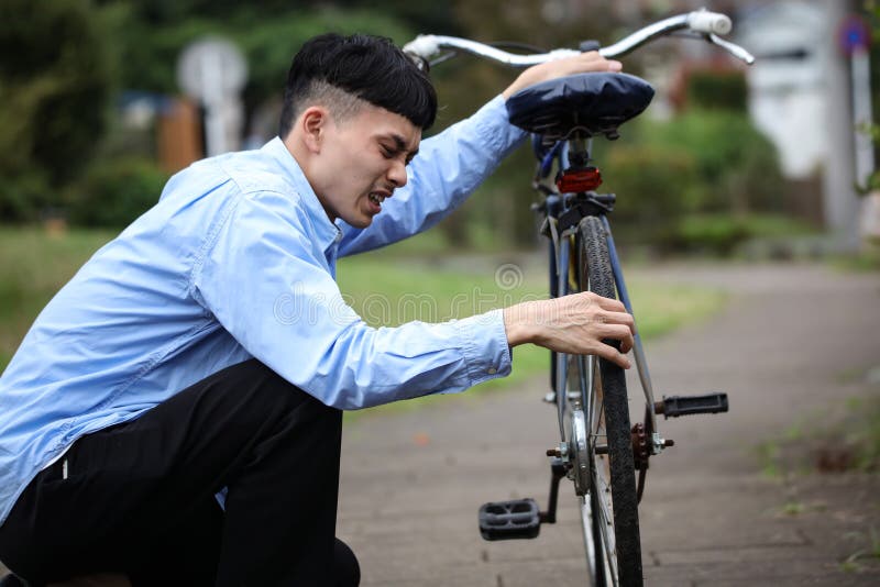 A Man with a Broken Bicycle Stock Image Image of businessmen, japan 245196177