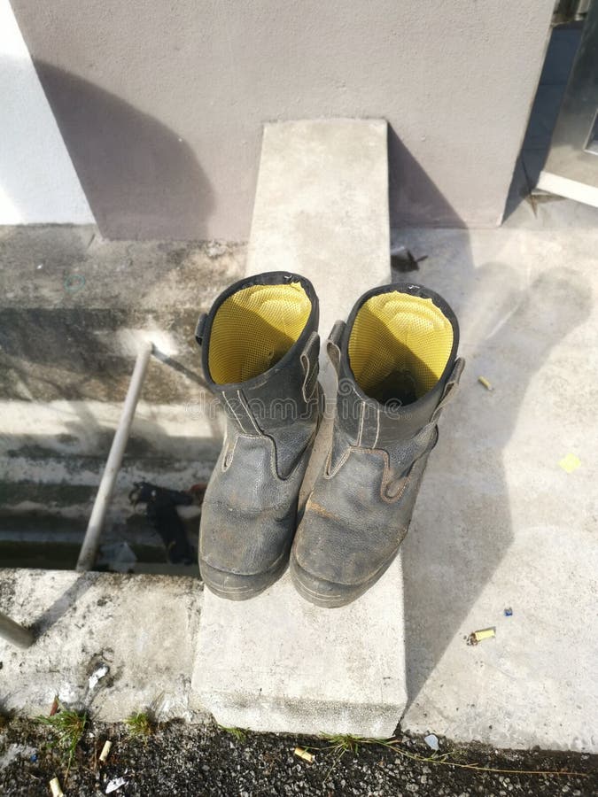 Old Leather Boot Drying on the Concrete Lap. Stock Photo Image of