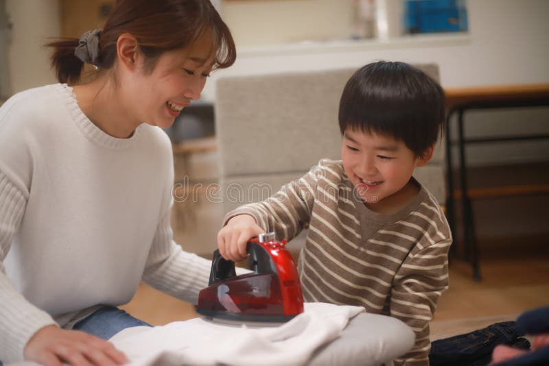 Parent and child to iron stock image. Image of asian 238943947