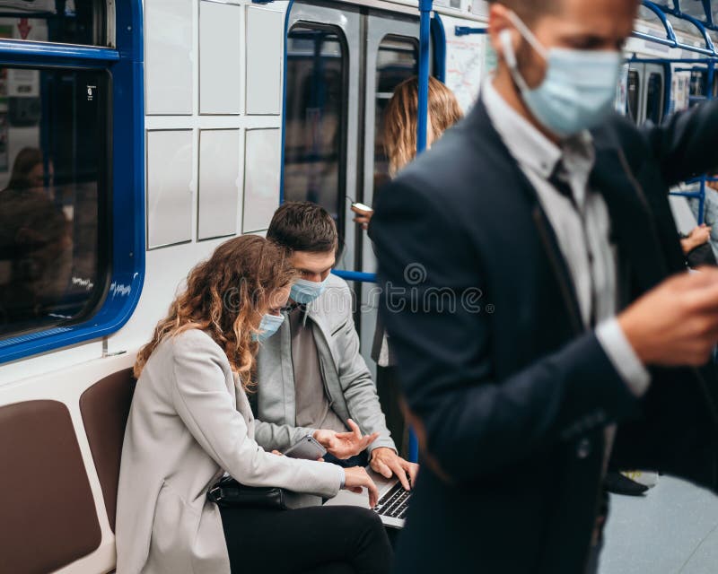 Image of passengers in protective masks in a subway car. royalty free stock image
