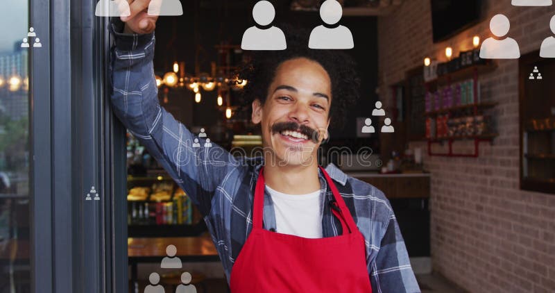 Image of profile icons flowcharts, smiling biracial male barista standing at entrance of cafe stock images