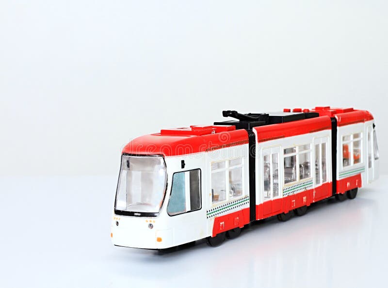 Plastic toy train on a white surface