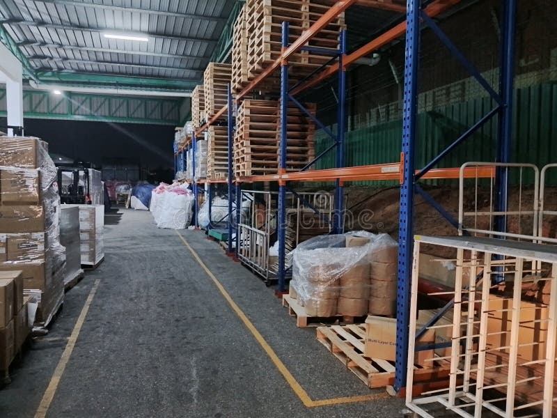 An image selective focus of warehouse with rack, box and pallet royalty free stock photos