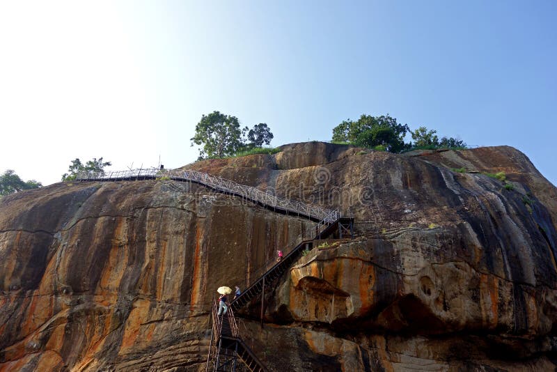 Tourists Descend the High Sigiriya Rock royalty free stock photo Tourists Descend the High Sigiriya Rock royalty free stock photo